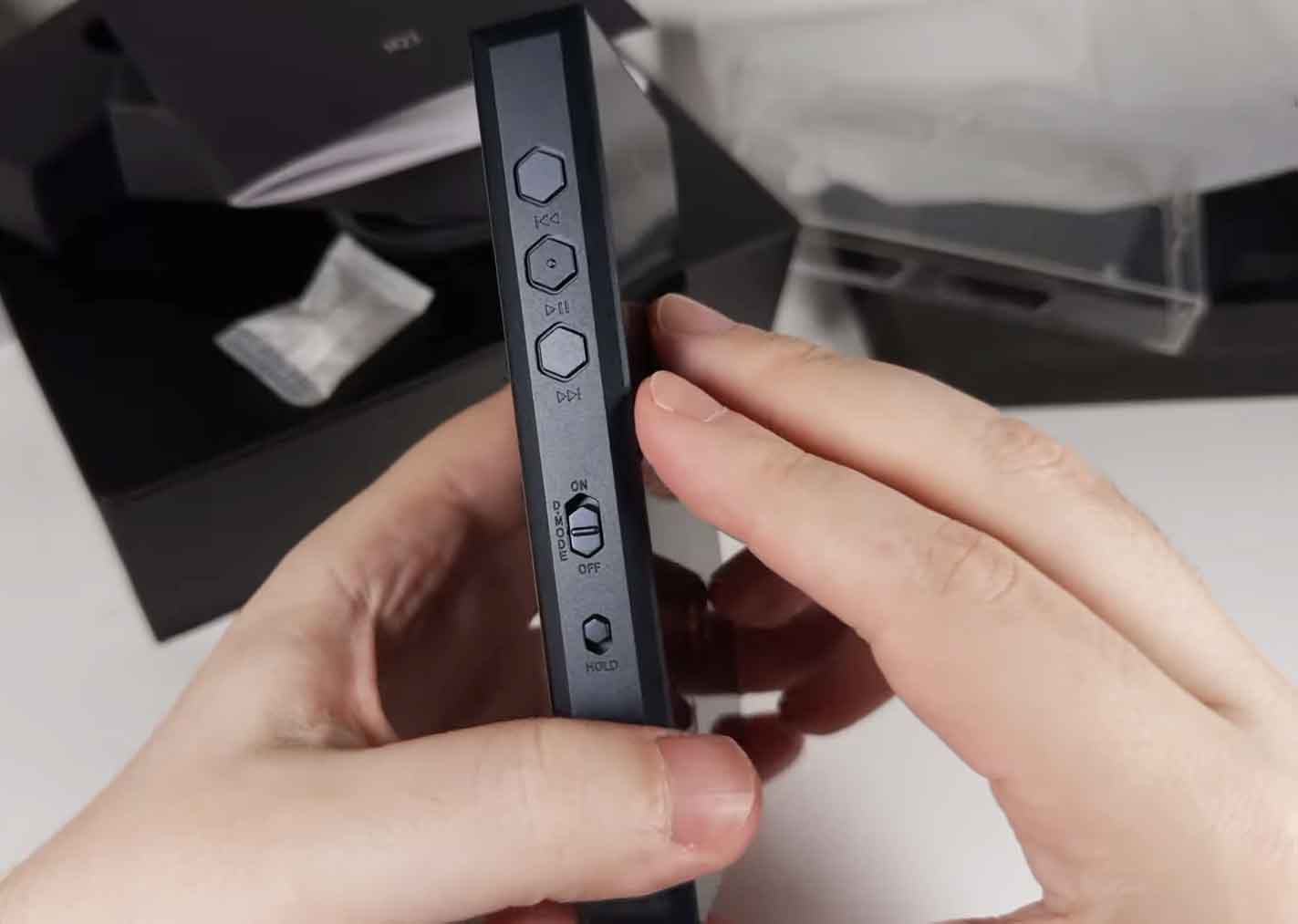 FiiO M23 side panel showing physical playback buttons, Desktop Mode switch, and Hold switch