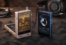 FiiO M33 R2R vs FiiO M23 portable digital audio players side-by-side on a desk