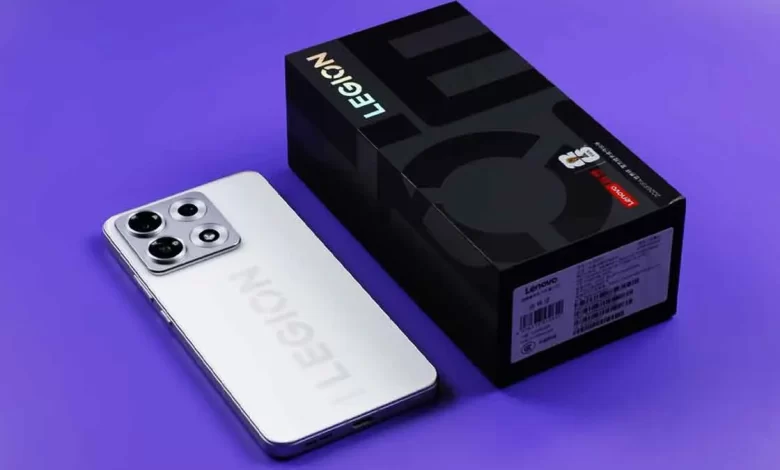 Lenovo Legion Y70 white edition smartphone resting beside its official black retail packaging box