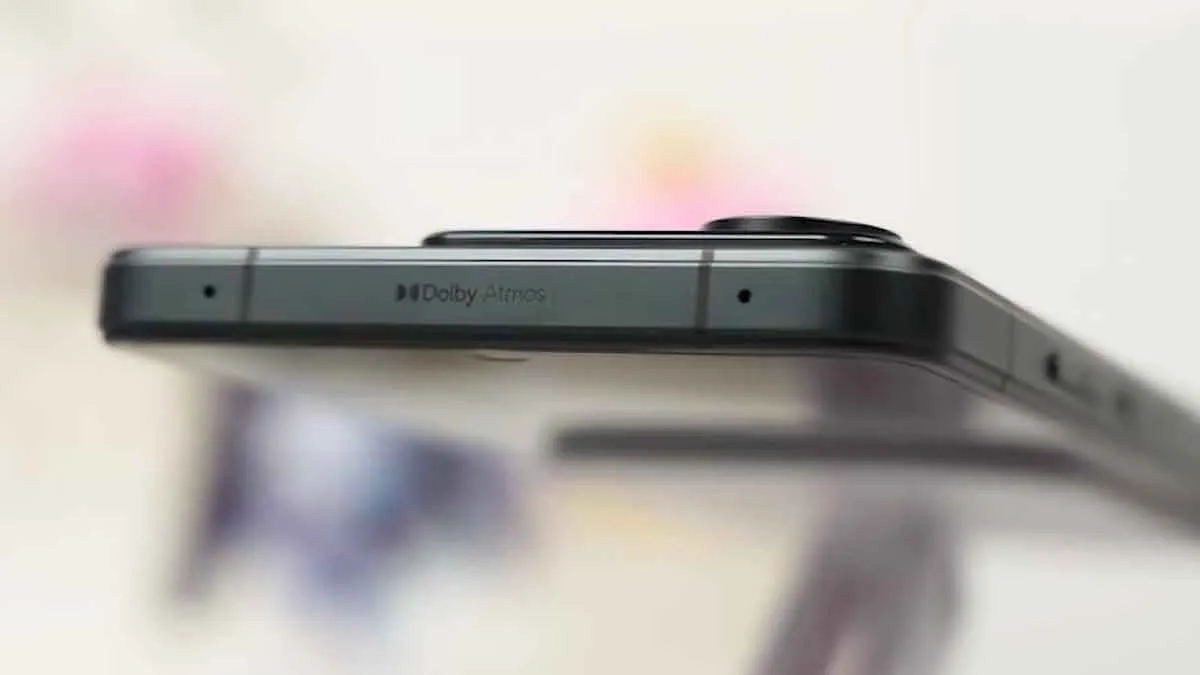 Lenovo Legion Y70 top aluminum rail showcasing Dolby Atmos branding, dual antenna bands, and microphone port