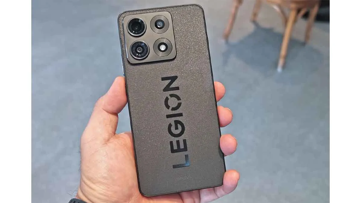 Lenovo Legion Y70 black edition handheld view showing textured matte glass finish and rear camera module