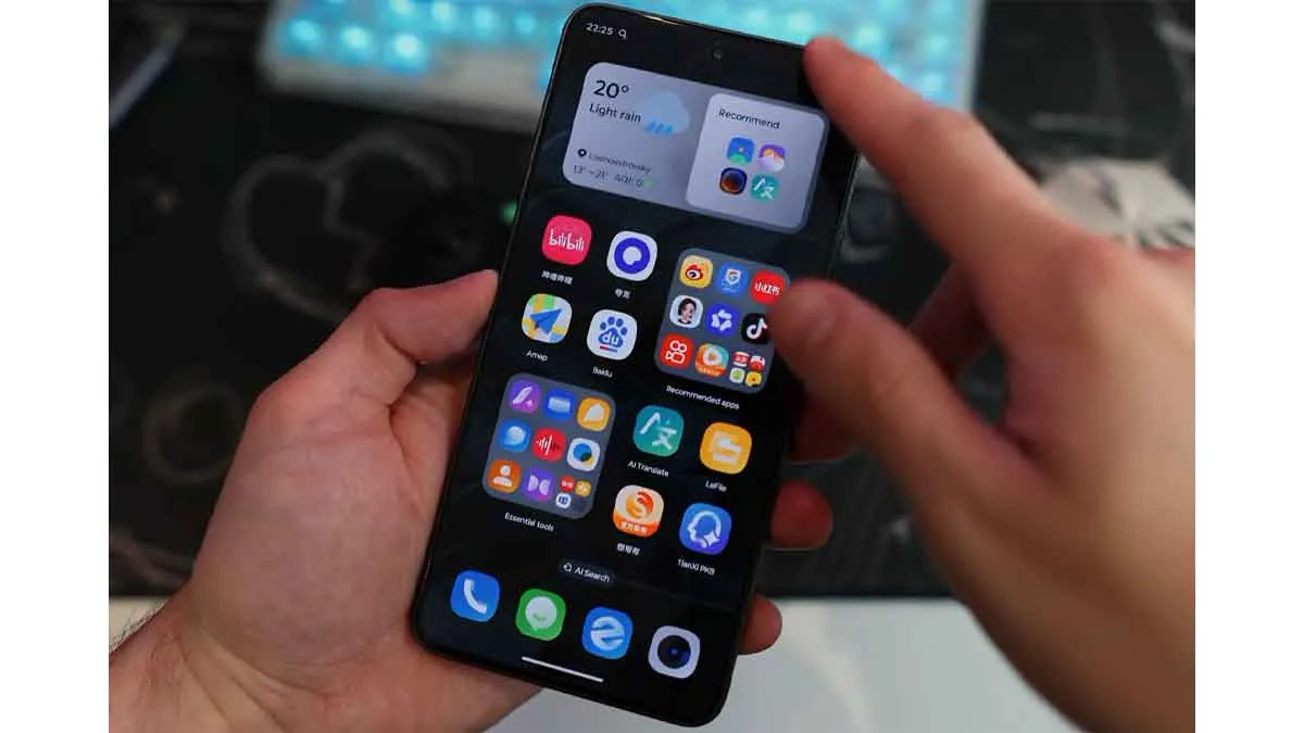 Hands testing touchscreen responsiveness on the Lenovo Legion Y70 front AMOLED display