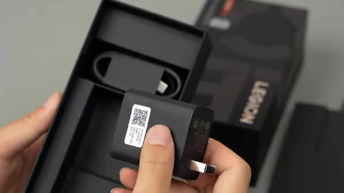 Lenovo Legion Y70 unboxing showing 90W fast charging power brick and Type-C cable inside the retail package