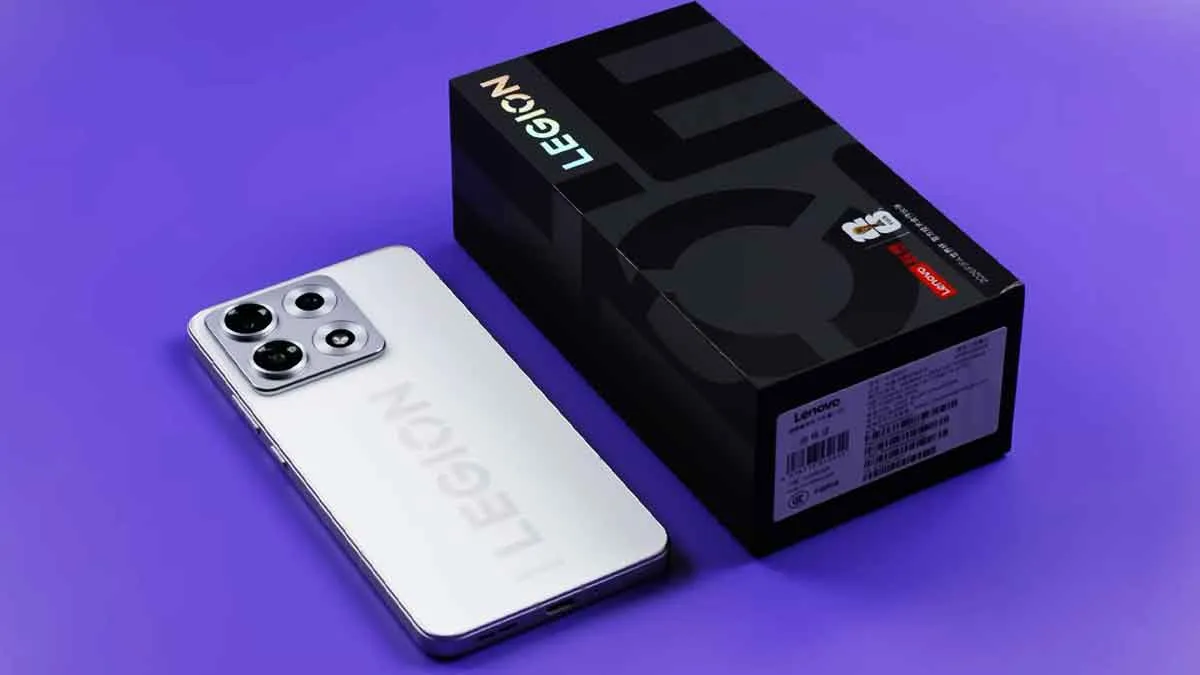 Lenovo Legion Y70 white edition smartphone resting beside its official black retail packaging box
